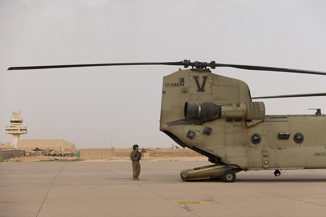 Ramp walkaround with airfield control tower in the background. U.S. Army photo.