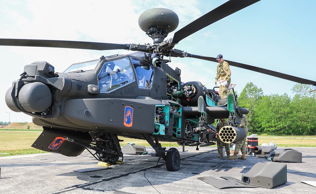 Apache preventive maintenance checks with access panels open. U.S. Army photo.
